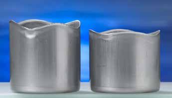 Figure 7: The influence of lubricant viscosity on drawing. The cup formed with the higher viscosity lubricant is on the left.S-26