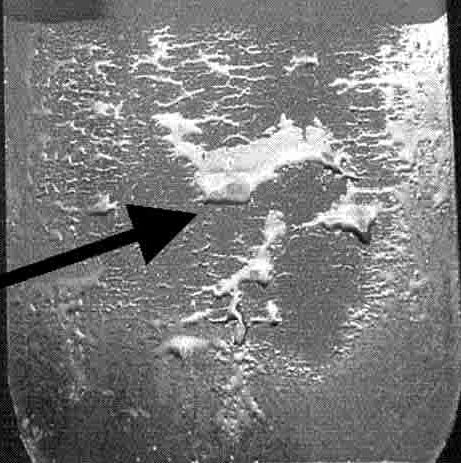 Figure 1: Poor wettability after galvanizing. SiO2 covers the surface in the bare areas, while the sparse areas covered with zinc correspond to reaction areas with an interfacial Fe2Al5 layer in between the zinc and steel. Modified from Citation D-49. http://devahssinsightsorg.x83upuviie-g96gne1n14oy.p.temp-site.link/citations/d-49/