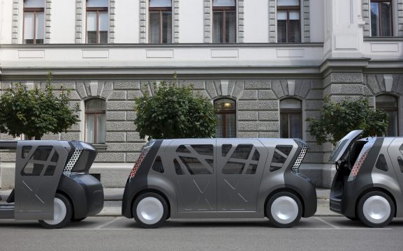 Steel E-Motive cars in a row - doors and rear hatch open